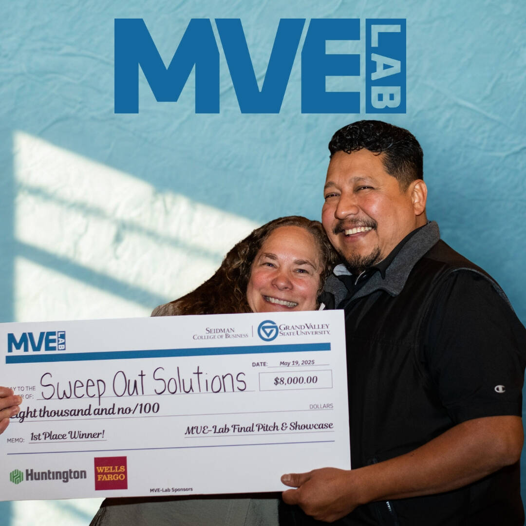 Couple holding a check